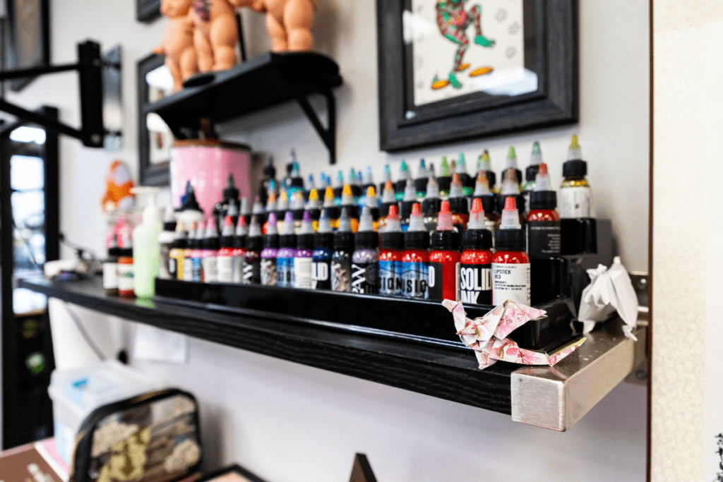 Rows of Tattoo Ink on a Shelf in a Variety of Colors